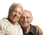 Photo of a man and woman smiling for a picture. Link to Life Stage Gift Planner Over Age 65 Gifts.